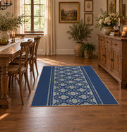 Blue and white geometric area rug with a minimal diamond pattern, front room mockup