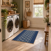 Blue and white geometric area rug with a minimal diamond pattern, design detail view