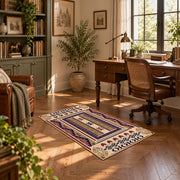 Beige and purple Southwestern area rug with bold tribal geometric motifs, complete product view