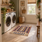 Beige and purple Southwestern area rug with bold tribal geometric motifs, wide interior view
