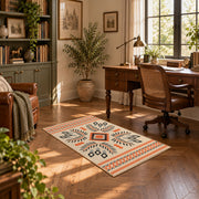 Cream and orange tribal diamond area rug with black and gray accents, complete product view