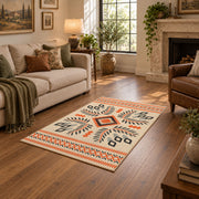 Cream and orange tribal diamond area rug with black and gray accents, design detail view