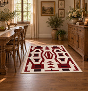 Burgundy and cream geometric area rug with a bold interlocking pattern, front room mockup