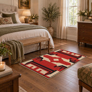 Red and black tribal cross area rug with cream geometric details, cozy home setting