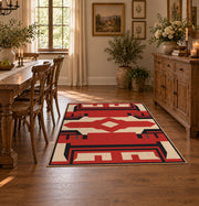 Red and black tribal cross area rug with cream geometric details, close decorative detail