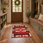 Red and black tribal cross area rug with cream geometric details, front room mockup