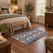 Blue and white diamond area rug with an allover traditional geometric pattern, cozy home setting