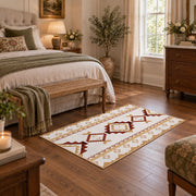 Cream and rust tribal area rug with brown and gold diamond motifs, cozy home setting
