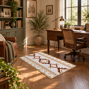 Cream and rust tribal area rug with brown and gold diamond motifs, complete product view