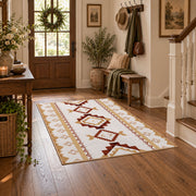 Cream and rust tribal area rug with brown and gold diamond motifs, wood floor styling