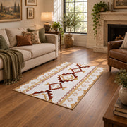 Cream and rust tribal area rug with brown and gold diamond motifs, design detail view