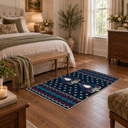 Navy and red Persian area rug with a detailed traditional medallion, cozy home setting