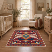 Red and blue ornate floral area rug with cream and teal scroll motifs, full pattern view
