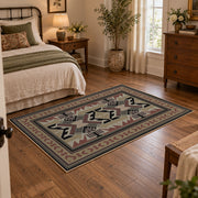 Gray and brown Southwestern area rug with black tribal geometric motifs, soft surface detail