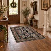 Gray and brown Southwestern area rug with black tribal geometric motifs, close decorative detail