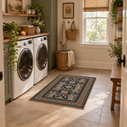 Gray and brown Southwestern area rug with black tribal geometric motifs, wide interior view