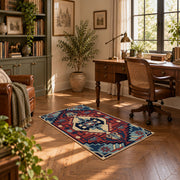 Blue and red tribal medallion area rug with cream and teal accents, complete product view