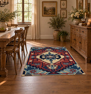 Blue and red tribal medallion area rug with cream and teal accents, close decorative detail