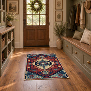 Blue and red tribal medallion area rug with cream and teal accents, front room mockup