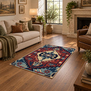 Blue and red tribal medallion area rug with cream and teal accents, design detail view