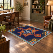 Navy and orange tribal area rug with red and cream geometric details, soft surface detail