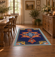 Navy and orange tribal area rug with red and cream geometric details, close decorative detail