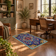 Blue and orange star medallion area rug with red geometric accents, complete product view
