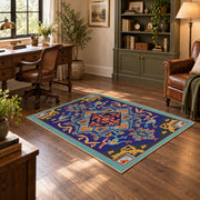 Blue and orange star medallion area rug with red geometric accents, soft surface detail