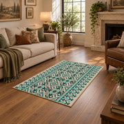 Mint and black geometric area rug with an allover modern tribal pattern, cozy home setting