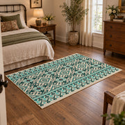 Mint and black geometric area rug with an allover modern tribal pattern, soft surface detail
