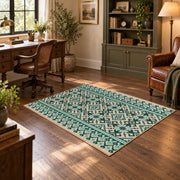 Mint and black geometric area rug with an allover modern tribal pattern, wood floor styling