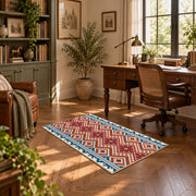 Red and cream diamond area rug with blue and black Southwestern details, complete product view