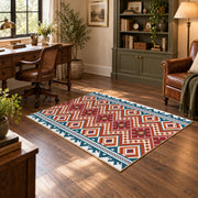 Red and cream diamond area rug with blue and black Southwestern details, soft surface detail