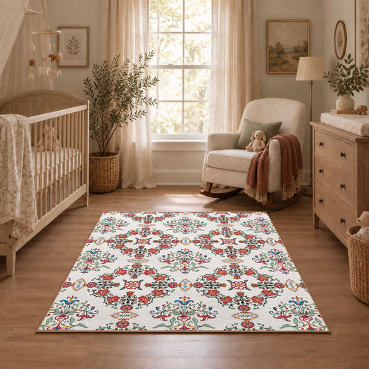 Cream and red floral vine area rug with teal and blue botanical details, angled room view