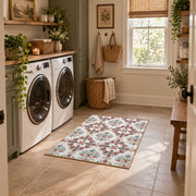 Cream and red floral vine area rug with teal and blue botanical details, wide interior view