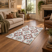 Cream and red floral vine area rug with teal and blue botanical details, design detail view