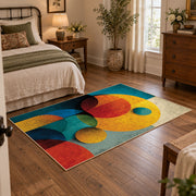 Colorful vintage geometric geometric forms area rug displayed beside a cozy bed