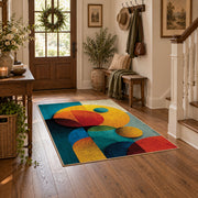 Colorful vintage geometric geometric forms area rug styled in a welcoming entryway