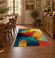 Colorful vintage geometric geometric forms area rug shown in a bright dining space