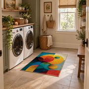 Colorful vintage geometric geometric forms area rug placed in a modern laundry room