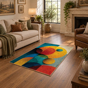 Colorful vintage geometric geometric forms area rug shown beside a comfortable sofa