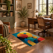 Colorful vintage geometric geometric forms area rug displayed in a sunlit home office