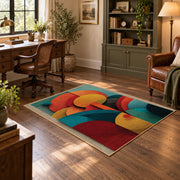 Colorful vintage geometric botanical area rug angled view in a classic bedroom