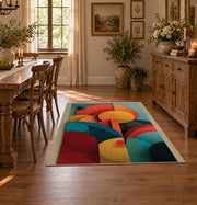 Colorful vintage geometric botanical area rug shown in a bright dining space