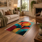Colorful vintage geometric botanical area rug shown beside a comfortable sofa