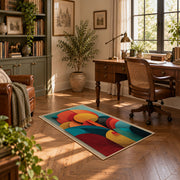 Colorful vintage geometric botanical area rug displayed in a sunlit home office