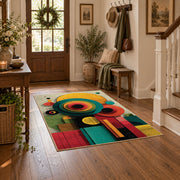 Colorful vintage geometric tree art area rug styled in a welcoming entryway