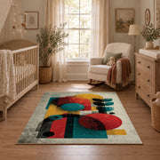 Colorful vintage geometric figurative art area rug shown in a calm nursery