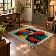 Colorful vintage geometric figurative art area rug angled view in a classic bedroom