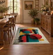 Colorful vintage geometric figurative art area rug shown in a bright dining space